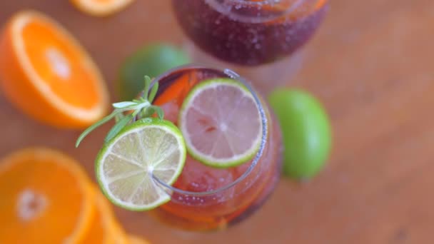 Refreshing sangria cocktail with fruit and ice — Stock Video
