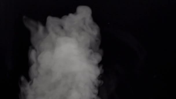 Smoke in slow motion on black background. — Stock Video