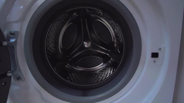 Domestic washing machine opening door ready to receive dirty clothes. — Stock Video