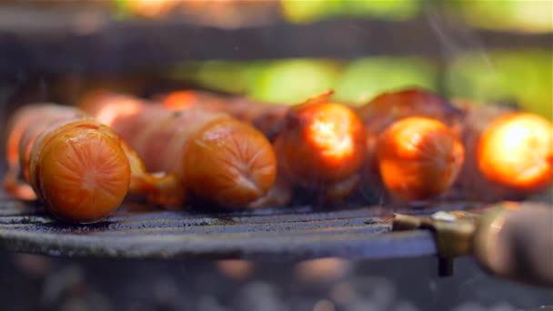 Grilled sausage with bacon. Sausages with bacon fried on the grill — Stock Video