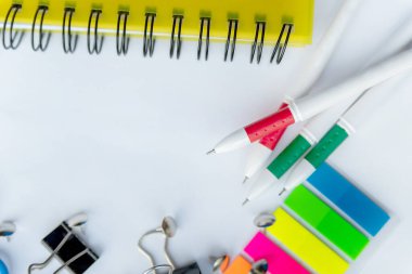 Flat lay mockup stationery, notepad, pens and pencils over  with copy space. Back to school concept.