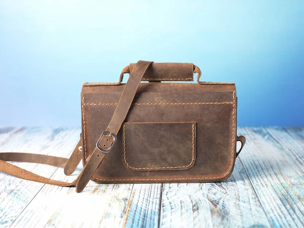 brown leather messenger bag