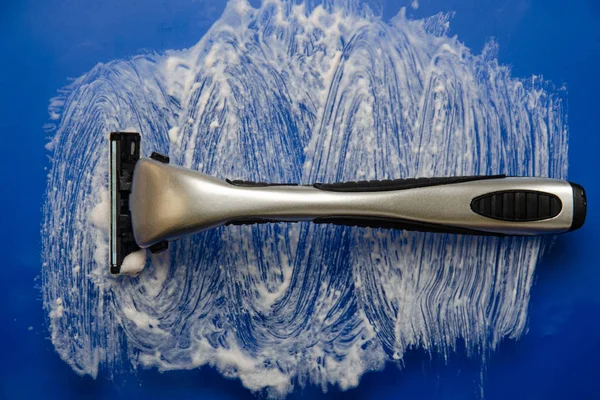 Shaving accessories. Razor and shaving brush. Top view .