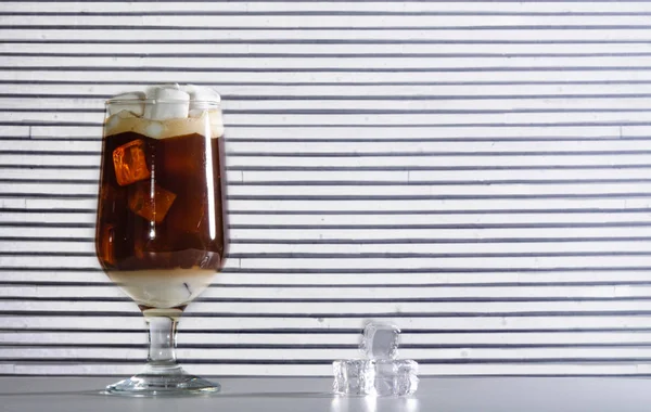 Iced coffee in a glass beaker