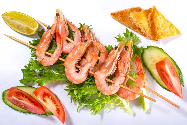 Shrimps Skewers Lettuce Leaves Cucumber Tomato Slices White Surface Top — Stock Photo, Image