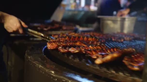 Chef cooking ribs on grill. — Stock Video