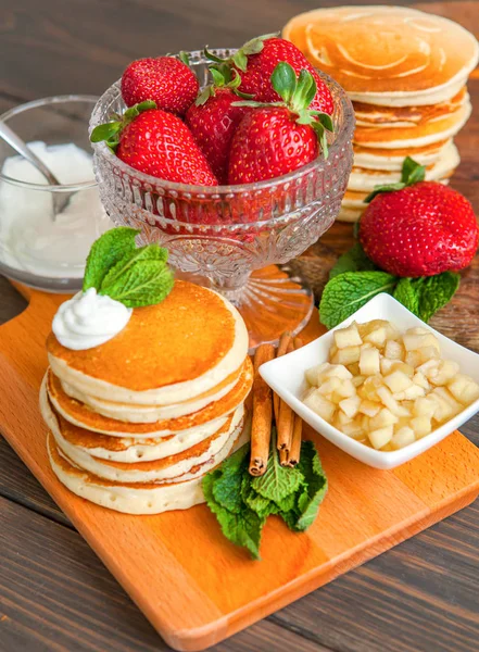 Delicious pancakes on wooden table with berries and fruits — Stock Photo, Image