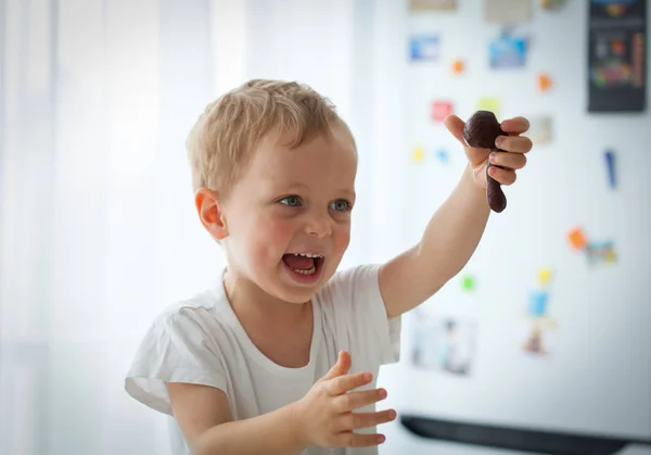 Cute little boy preparing Christmas cookies at home — Stock Photo, Image