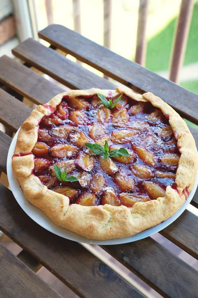 Plum tart with cinnamon. Portion of cake on a plate with shallow depth of field.