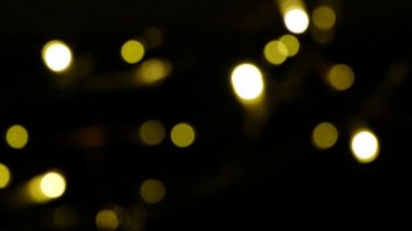 Altın soyut bulanık yüzen bokeh arkaplan 4K noel ve tatillerde.