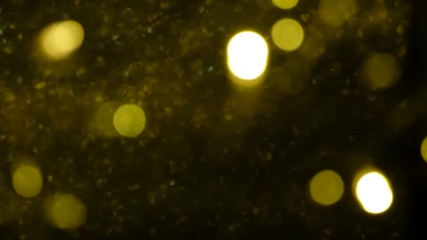 Goud abstract wazig zwevend bokeh achtergrond in 4k voor kerst en feestdagen. — Stockvideo