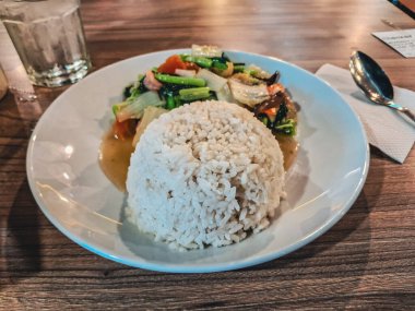fried rice and pork with vegetable