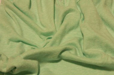 Bu Açık Yeşil Kumaş arkaplanının bir fotoğrafı