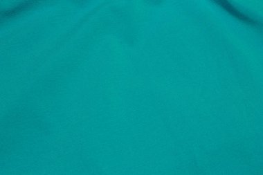Bu Turkuaz kumaş arka planının bir fotoğrafı.