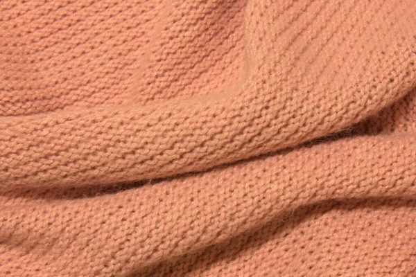 Bu Pembe yün kumaş arka planının bir fotoğrafı.