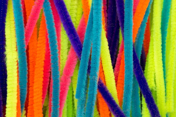 Mavi, Yeşil, Turuncu, Sarı ve Pembe renkli Chenille çubukları arka plan