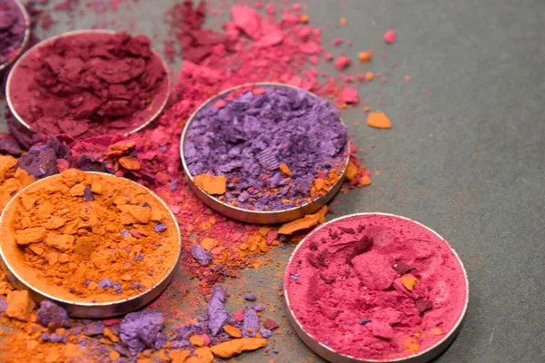 Orange,Pink,Purple,Lilac and Red crushed Eyeshadow on a Black background