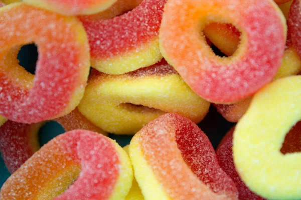 This is a photograph of sour peach candy rings