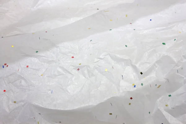 Esta Uma Fotografia Papel Embrulho Tecido Branco Com Confete — Fotografia de Stock