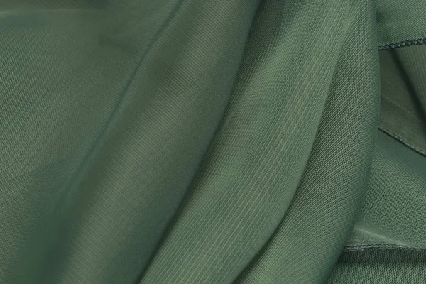 This is a photograph of Green Polyester fabric