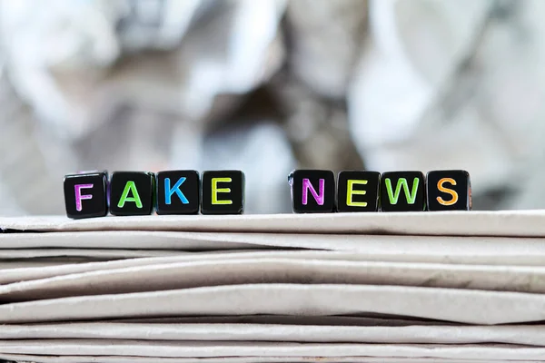 Inscription Fake News Stack Newspapers Background Crumpled Newspaper Concept Closeup — Stock Photo, Image