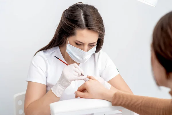 Manicure Master Protective Mask Applying Transparent Nail Polish Female Nails — Stock Photo, Image