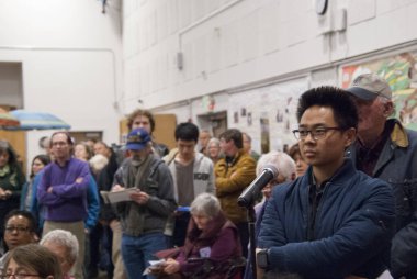 Residents line up to discuss building housing at the North Berkeley BART station at a public meeting at the Berkeley Adult School on March 15, 2018.
