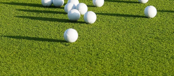 top view flat lay of golf balls on grass background, the concept of a sport for the rich, luxury, fitness, game.