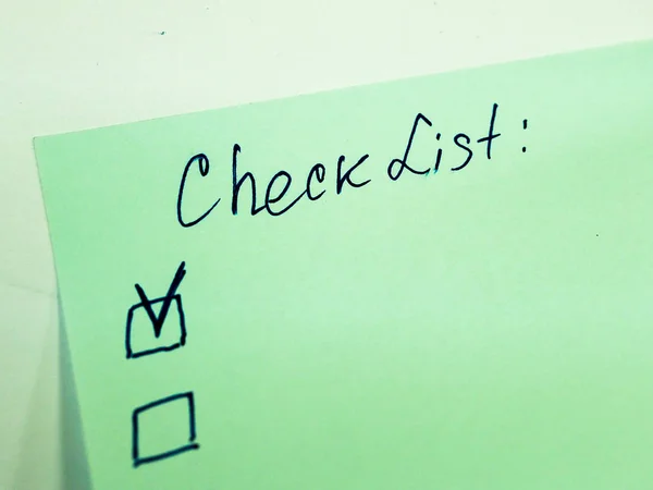 Sticky note with text to do list, checklist.