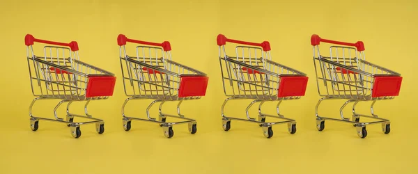 Shopping cart on yellow background. Minimalism style. Creative design. — Stock Photo, Image