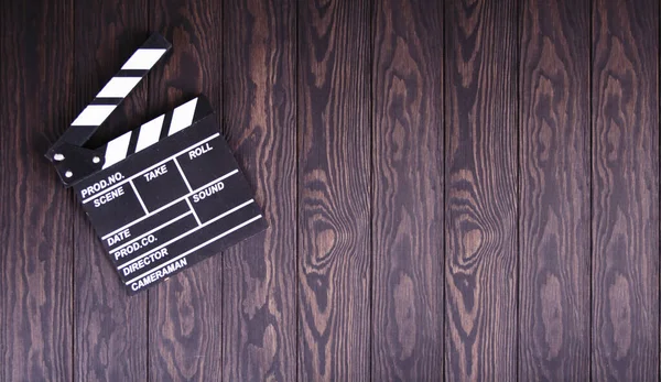 Clapperboard op houtconcept de filmindustrie, film, film, Golden globe en Oscar als ondergrond — Stockfoto