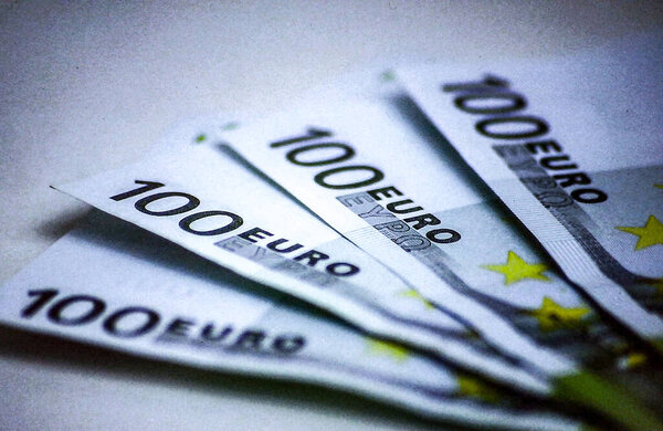 Stack of 100 Euro banknotes displayed as currency symbol. Concept for finance, wealth, banking, and European economy