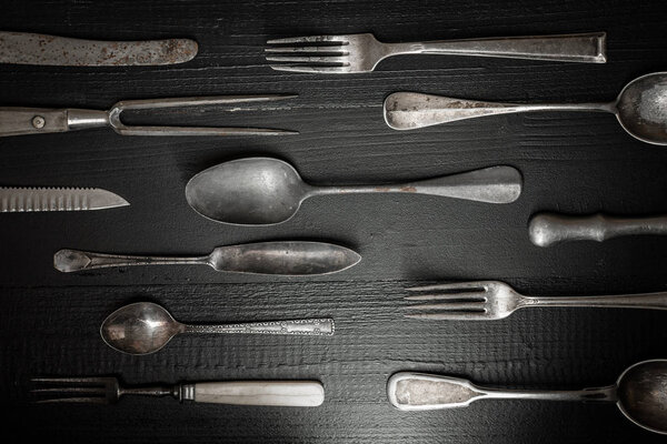 Rustic Cutlery on Old Dark Wooden Background. Silverware and Foo