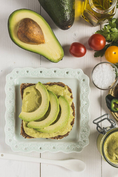 Fresh Avocado Spread Guacamole as Healthy Breakfast on White Bac