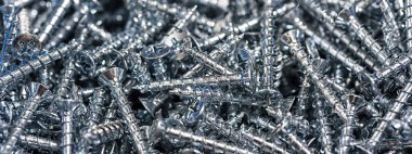 Gümüş vida makro yakın çekim. Arka plan deseni.