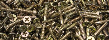 Altın vida makro yakın çekim. Arka plan deseni.