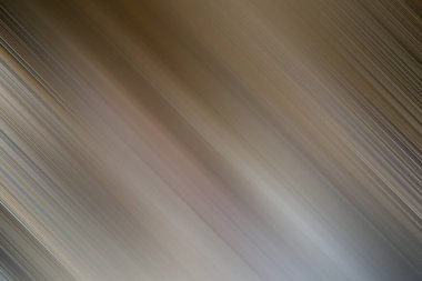 Bu resim, kahverengi, gri ve bej köşeli köşegen çizgileri içeren soyut bir hareket bulanık arkaplanı gösterir. Dinamik etki bir hız ve hareket hissi yaratır..