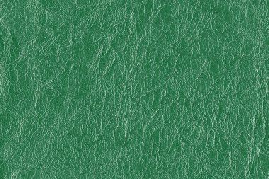 İnce dikey çizgilerle dokulu yeşil bir yüzeyin yakından ve soyut görüntüsü derinlik ve hareket hissi yaratıyor..