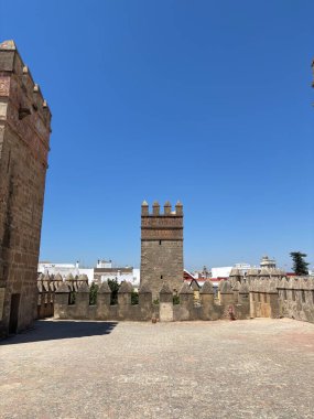 Spain: Historic Castillo de San Marcos in El Puerto de Santa Mara, a 13th-century fortress with Gothic towers and wine cellar, under summer light.