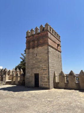 Spain: Historic Castillo de San Marcos in El Puerto de Santa Mara, a 13th-century fortress with Gothic towers and wine cellar, under summer light.