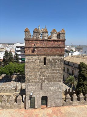Spain: Historic Castillo de San Marcos in El Puerto de Santa Mara, a 13th-century fortress with Gothic towers and wine cellar, under summer light.