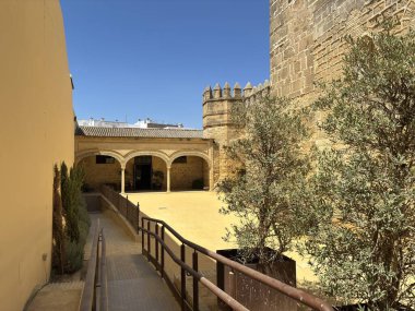 Spain: Historic Castillo de San Marcos in El Puerto de Santa Mara, a 13th-century fortress with Gothic towers and wine cellar, under summer light.