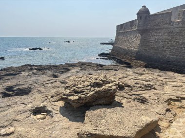 Spain: Historic Castillo de San Sebastin in Cdiz, a 1706 fortress on a small islet with a lighthouse and Atlantic views.
