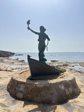 Spain: Liberty-inspired Monumento a la Memoria Democrtica in Rota, honoring Spanish Civil War and dictatorship victims on the coastal espign breakwater.