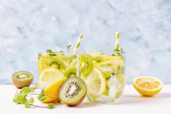 Cool Fresh Yellow Armelon Kiwi Lemonade Ingredients Bright Blue Background — стоковое фото