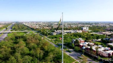 Pakistani National Flag Waving in Blue Sky.