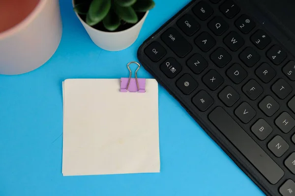 blank paper next to school tools with no word as a template for text space concept. business and education concept