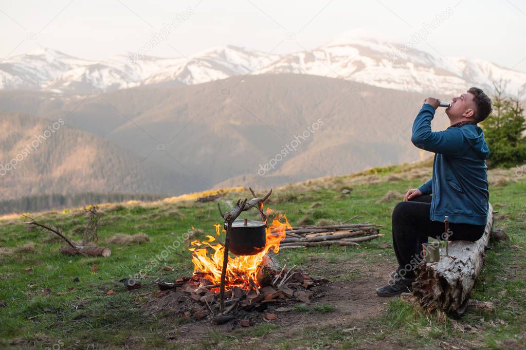 Cooking on a campfire in the mountains