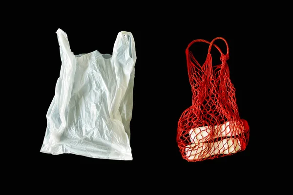 Plastic bags and cotton string bag, as his zero waste alternative, for containing and transporting goods, to phase-out lightweight plastic bags, causing pollution of environmental impacts. Isolated