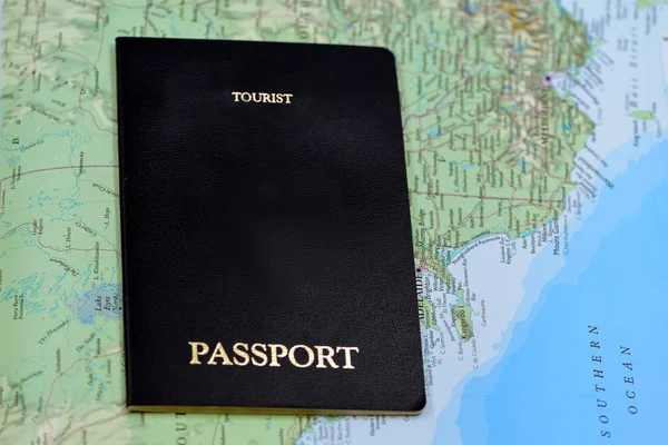 Tourist passport on a background of the map of Australia